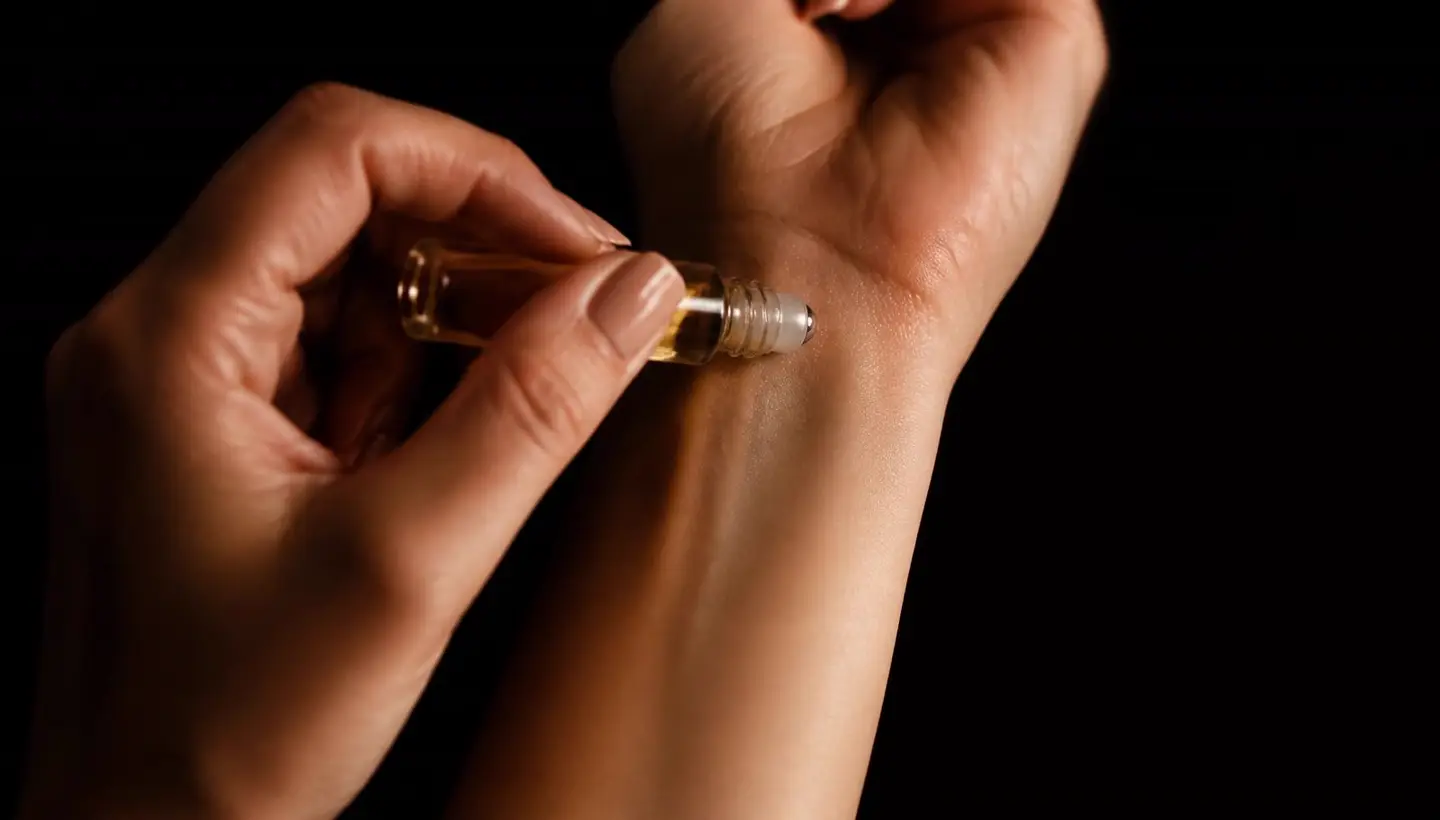 Attar oil applied to the wrist pulse point — Mirage Attars guide